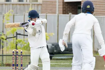  ??  ?? Adam Feltham pulls this ball onto the leg side for runs as he made an unbeaten 67 in Division Two on Saturday.