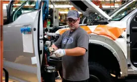  ??  ?? American carmakers have been hit by Trump’s tariff battle with China. Photograph: Jeff Kowalsky/AFP/Getty Images