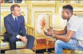  ?? REUTERS ?? French President Emmanuel Macron (left) meets Mamoudou Gassama, 22, from Mali at the Elysee Palace in Paris.