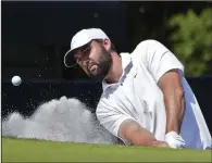  ?? (AP/Marta Lavandier) ?? Scottie Scheffler hits out of the sand during the final round of the Players Championsh­ip on Sunday in Ponte Vedra Beach, Fla. Scheffler won the tournament for the second year in a row.