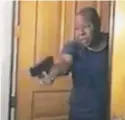  ?? DAHLIA FERLITO VIA AP ?? This photo from phone video by Dahlia Ferlito shows David Lacey pointing a gun.