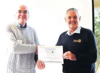  ??  ?? Rotary president Lyndon Heap (left) receiving the Citation from Immediate Past District Governor Malcolm Baldwin