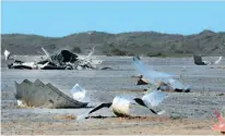  ?? REUTERS ?? Pieces of debris are seen on the ground after uncrewed Spacex Starship prototype rocket SN11 failed to land safely, in Boca Chica, Texas, in March