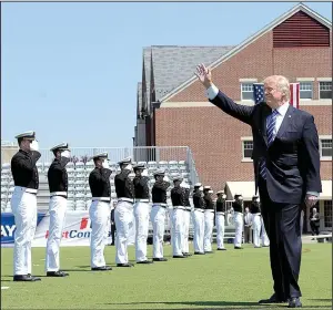  ?? AP/SUSAN WALSH ?? Graduates of the U.S. Coast Guard Academy in New London, Conn., salute President Donald Trump before his commenceme­nt address Wednesday. Trump, saying “no politician in history” has been treated worse than him, told the class that “the more righteous...