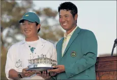  ?? AP ?? Hideki Matsuyama, of Japan, celebrates after putting on the champion's green jacket after winning the Masters Tournament.