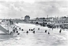  ?? ?? Behind enemy lines: the Allies land on Juno Beach on June 6, 1944