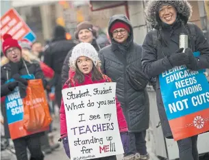  ?? RICK MADONIK TORONTO STAR ?? Members of the Elementary Teachers’ Federation of Ontario marched along Front Street West on Tuesday to protest their stalled contract talks with the provincial government.