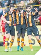  ??  ?? Hull’s Alfred N’Diaye is mobbed.