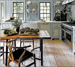  ?? ERIC PIASECKI/SR GAMBREL ?? “A table has a domestic warmth to it that an island doesn’t,” New York interior designer Steven Gambrel says.