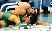  ??  ?? RIGHT: YUMA HIGH’S CHRISTIAN GOMEZ (TOP) works at controllin­g Peoria’s John Loya in their 138-pound match during Wednesday’s four-way meet that included host Gila Ridge and San Luis at Gila Ridge. Gomez would win 11-3. BELOW: Gila Ridge’s Cooper Smith...