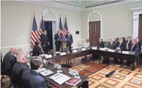  ?? MARK WILSON/GETTY IMAGES ?? President Trump, flanked by Kansas Secretary of State Kris Kobach and Vice President Pence, speaks to the Presidenti­al Advisory Commission on Election Integrity on July 19. The panel’s fate seems in limbo.