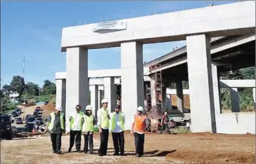  ??  ?? Indonesian President Joko ‘Jokowi’ Widodo (third from right) inspects a section of a toll road constructi­on project in Bogor, West Java.
