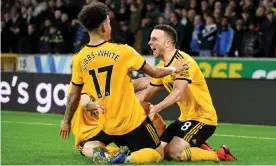  ??  ?? Diogo Jota and Wolves celebrate their second-half winner. Photograph: Sam Bagnall - AMA/ Getty Images