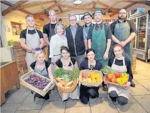 ??  ?? > John and Rosemary Barnes with their staff at Packington Moor Farm shop