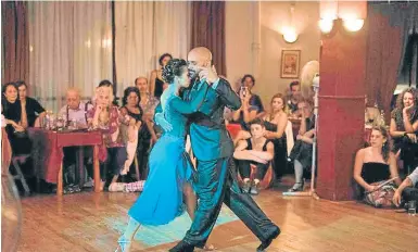  ?? AFP ?? Stage tango world champion María Noel Sciuto (left), dances with Rodrigo Fleitas during an exhibition event at the Chamuyo milonga in Montevideo.