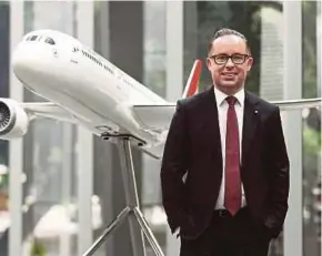  ?? BLOOMBERG PIC ?? Qantas chief executive Alan Joyce says debt is towards the bottom of the airline’s target range with every division returning more than its cost of capital.