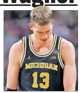  ?? AP ?? WAG’S NO DOG: Michigan’s Moe Wagner did his best against No. 1 Villanova, but the Wildcats’ firepower proved too much.