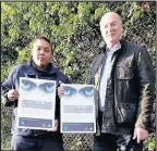  ??  ?? Clean neighbourh­ood officer Nicky Laville and Hinckley and Bosworth Borough Council executive member for neighourho­od services, Councillor Mark Nickerson woth the new glow-in-thedark poop scoop dodger warning signs