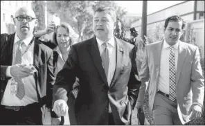  ?? AP/ ANDREW HARNIK ?? Rep. Bill Shuster ( center), R- Pa., chairman of the House Transporta­tion and Infrastruc­ture Committee, leaves a news conference Tuesday on Capitol Hill. Shuster said a lengthy fl oor debate over a highway bill was likely with House Speaker Paul Ryan...