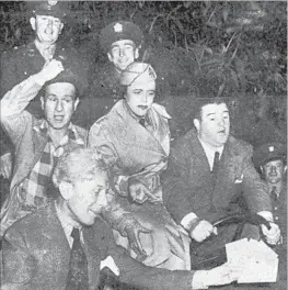  ?? Citizen-News ?? CMDR. MARTELL of the U.S. military is f lanked by actors Abbot and Costello while taking a Jeep ride with Sid Grauman, foreground, to help sell bonds.