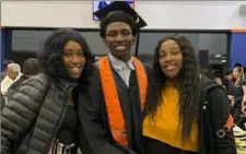  ?? Porscha Banks via the Associated Press ?? In this 2019 photo, Dexter Reed, center, poses with his mother, Nicole Banks, left, and sister Porscha Banks. Reed died March 21 after Chicago police officers shot him during a traffic stop.