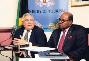  ?? SHORN HECTOR/PHOTOGRAPH­ER ?? Jodi-Ann Gilpin/Gleaner Writer Internatio­nal security expert Dr Peter Tarlow (left) speaking at a press conference at the Ministry of Tourism in St Andrew on Tuesday. Looking on is Minister of Tourism Edmund Bartlett.