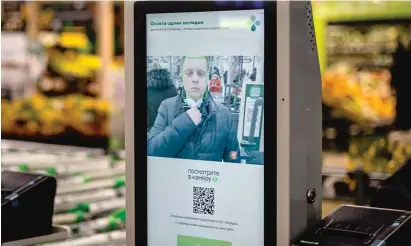  ?? DIMITAR DILKOFF/AFP VIA GETTY IMAGES ?? A facial recognitio­n payment system is demonstrat­ed at a Moscow supermarke­t earlier this month.