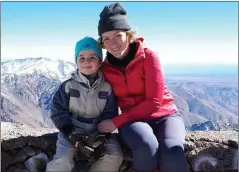  ??  ?? Joshua pictured with his mother Lyndsey who said Joshua had no problem with the climb whatsoever and now wants to be the youngest person to climb Kilimanjar­o in 2019.