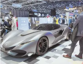  ?? AP PHOTO ?? HIGH-END AUTOS: The Zagato Isorivolta Vision Gran Turismo, left, is displayed at the Geneva Internatio­nal Motor Show.