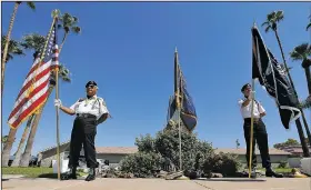  ?? AP/ROSS D. FRANKLIN ?? Members of the POW-MIA-KIA Honor Guard stand Sunday in front of a local mortuary where the body of the late Arizona Sen. John McCain is kept in Phoenix.