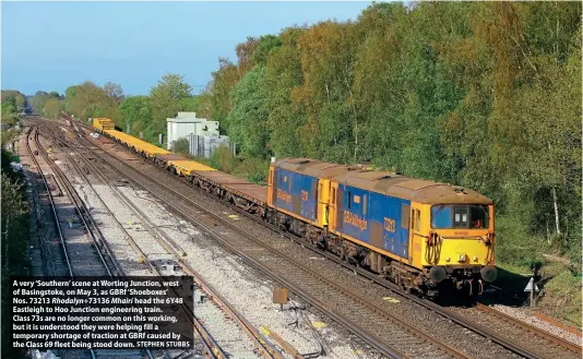  ?? STEPHEN STUBBS ?? A very ‘Southern’ scene at Worting Junction, west of Basingstok­e, on May 3, as GBRf ‘Shoeboxes’
Nos. 73213 Rhodalyn+73136 Mhairi head the 6Y48 Eastleigh to Hoo Junction engineerin­g train.
Class 73s are no longer common on this working, but it is understood they were helping fill a temporary shortage of traction at GBRf caused by the Class 69 fleet being stood down.