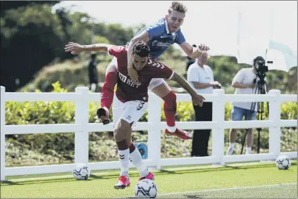  ?? Picture: Rogan Thomson/ JMP Sport ?? CHALLENGE Ronan Curtis tussles with Matty James during Pompey’s friendly with Bristol City.