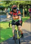  ??  ?? Christa Bender, 39, of Birdsboro, waves to the camera during her group ride.