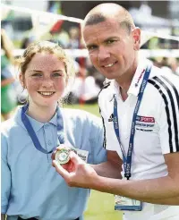  ??  ?? Rik with Niamh Barry, winner of the year seven girls’ 600 metres