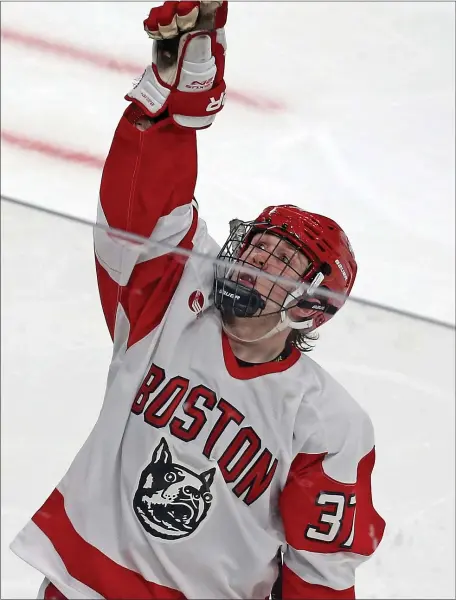  ?? MATT STONE — BOSTON HERALD ?? Matt Brown of Boston University celebrates his goal during the second period of the opening round of the 2022 Beanpot against Harvard at the TD Garden.