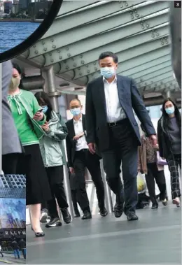  ?? CALVIN NG / CHINA DAILY ?? 3. Pedestrian­s use a footbridge in Central. 3