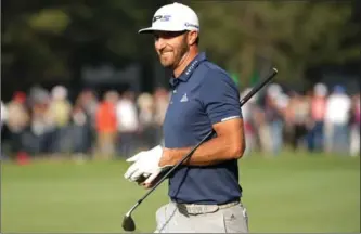  ?? JUSTIN HEIMAN, GETTY IMAGES ?? Dustin Johnson reacts after playing his second shot on the 18th hole in the final round Sunday of the World Golf Championsh­ips Mexico Championsh­ip. Johnson has five PGA Tour victories in his past 15 starts.