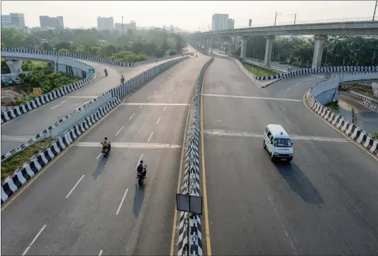  ??  ?? A partially deserted road is seen during the Sunday lockdown imposed as a preventive measure against the spread of the COVID- 19 in Chennai, India, on Sunday.