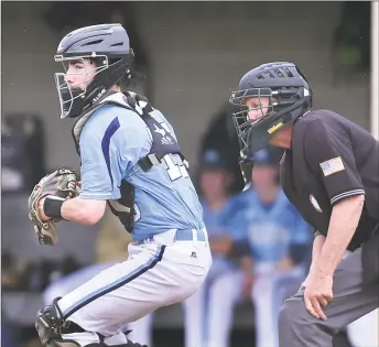  ?? Catherine Avalone / Hearst Connecticu­t Media ?? Middletown senior catcher Jake Radziewicz keeps his eye on Northwest Catholic baserunner­s on May 16 in a non-conference game at Middletown High School.