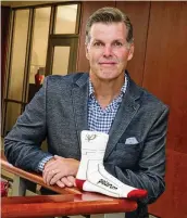  ?? ?? Patrick Baker, co-founder and CEO of Palarum LLC, shows one of its PUP SmartSocks, which is woven with a conductibl­e yarn that streams data and can summon nurses to help a patient who falls in their hospital room. Falls cost hospitals more than $10,000 per incident.