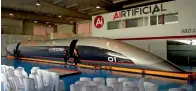  ?? — AFP ?? A full-scale passenger Hyperloop capsule is presented by Hyperloop Transporta­tion Technologi­es in El Puerto de Santa Maria, Spain, on Tuesday.