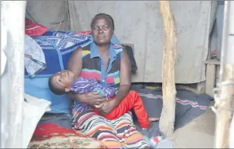  ?? Photo: Albertina Nakale ?? A mother’s anguish… Johanna George with her nine-year-old son Paulus Kanyanga.