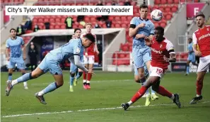  ??  ?? City’s Tyler Walker misses with a diving header