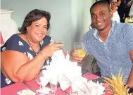  ?? CONTRIBUTE­D PHOTOS ?? Debe Lange-Chen, managing director of Cutting Edge Gourmet, shares a toast with Orhan Cato, brand manager of wines at Caribbean Producers Jamaica.