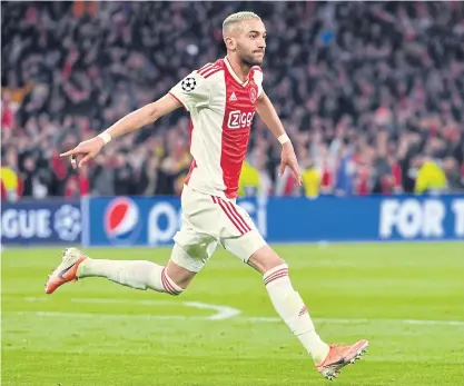  ??  ?? Ajax’s Hakim Ziyech celebrates after scoring a goal during a Champions League match this season.