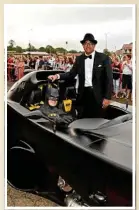  ??  ?? Arriving in the Batmobile is Jeffrey Ferrer, with Craig Blackburn (Batman).