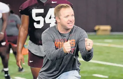  ?? COURTESY OF VIRGINIA TECH ATHLETICS ?? New running backs coach Adam Lechtenber­g has plenty of experience working with Virginia Tech head coach Justin Fuente, dating to 2007.