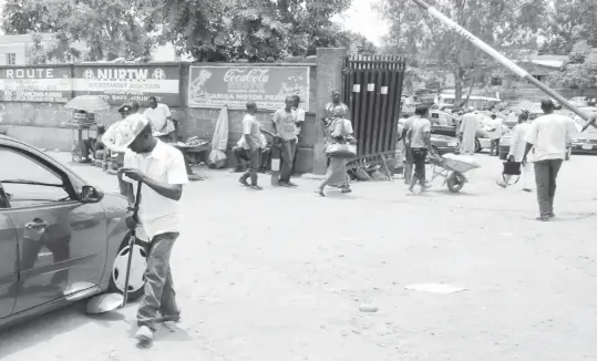  ?? PHOTO: NAN ?? An official of Nigeria Union of Road Transport Workers (NURTW), screening a vehicle with a bomb detection device at the entrance of a Motor Park in Jos yesterday.