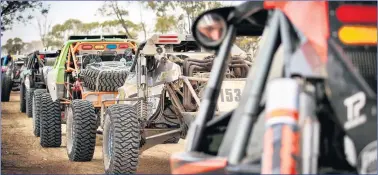  ?? ?? READY TO RACE: Off-road competitor­s line up for action.