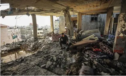  ?? ?? A Palestinia­n man sits amid a damaged of his house after an Israeli strike in Rafah, southern Gaza Strip Photograph: Ismael Mohamad/ UPI/REX/Shuttersto­ck